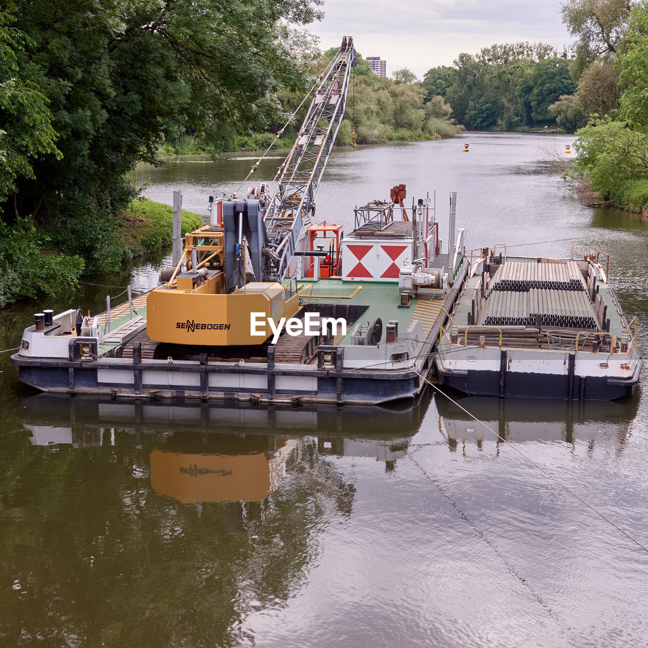 BOATS MOORED IN RIVER