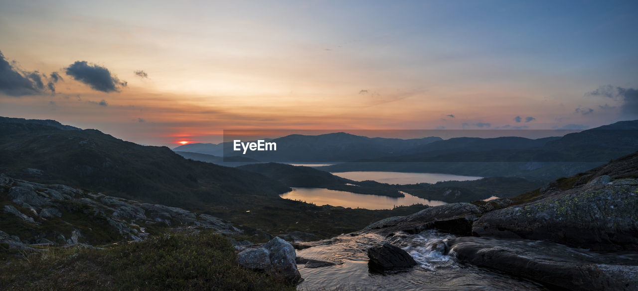 SCENIC VIEW OF MOUNTAINS DURING SUNSET