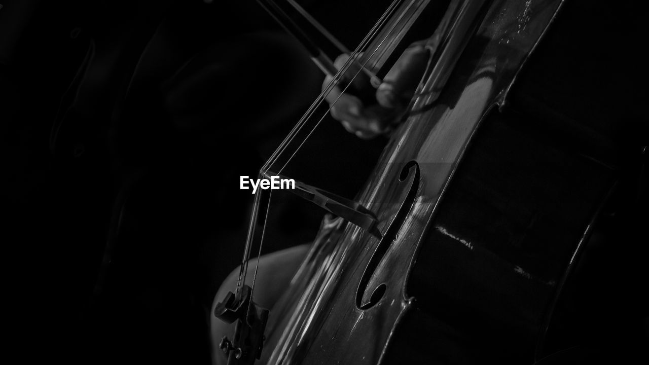 Close-up of violin against black background