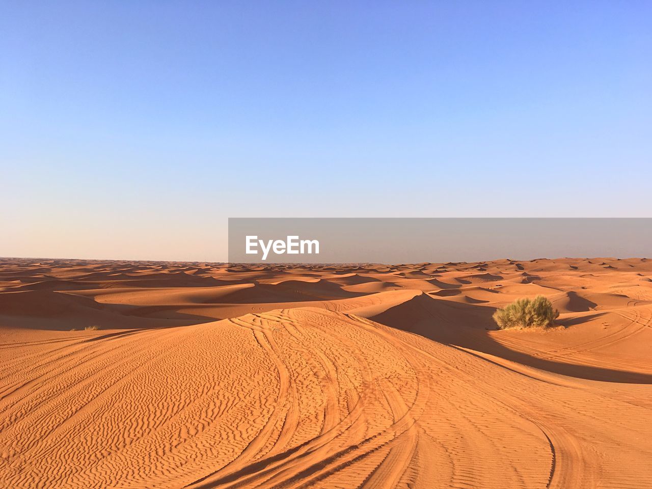 Scenic view of desert against clear sky