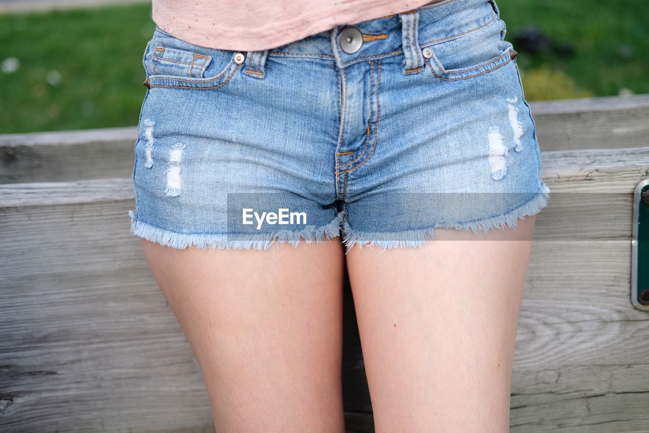 Midsection of woman wearing shorts