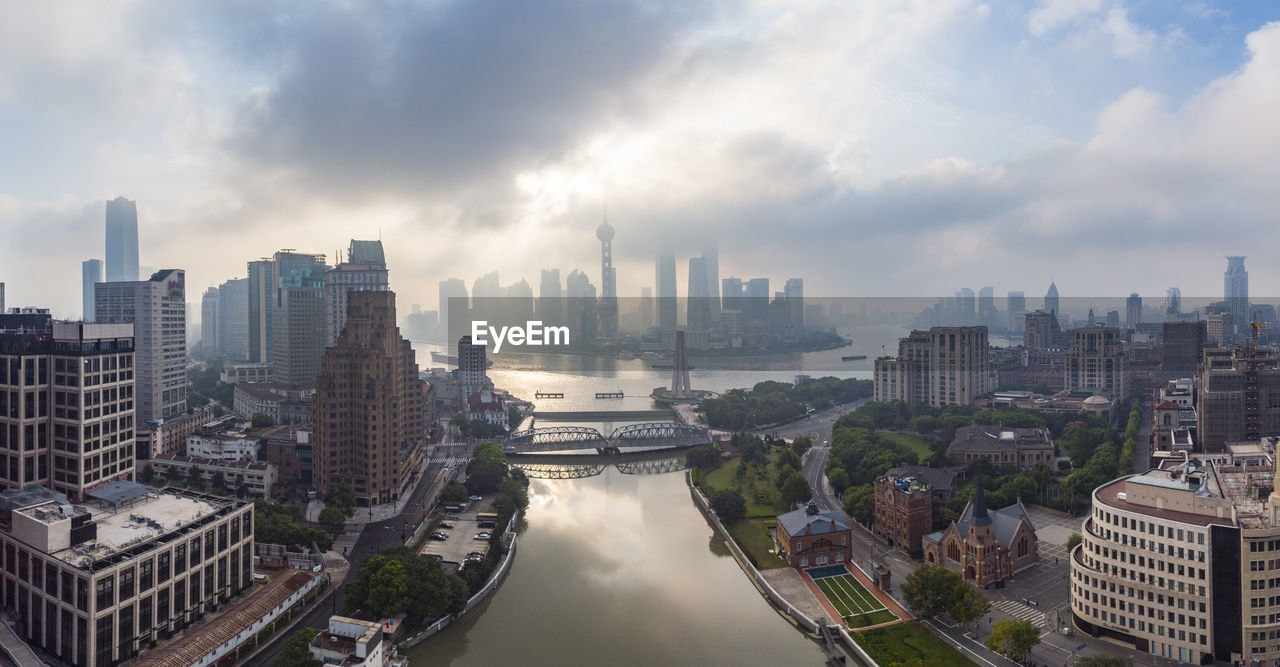 HIGH ANGLE VIEW OF BUILDINGS AGAINST SKY