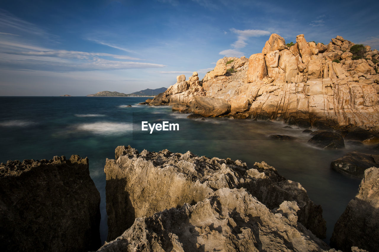 SCENIC VIEW OF SEA AND MOUNTAINS