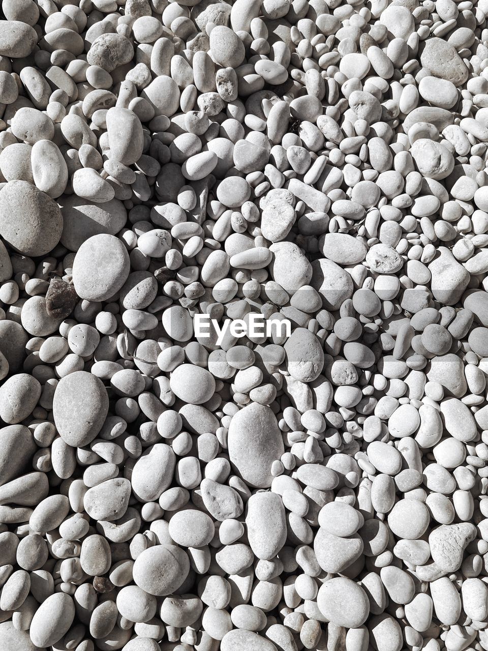 pebble, black and white, full frame, backgrounds, large group of objects, abundance, gravel, no people, stone, monochrome, monochrome photography, textured, rock, nature, flooring, pattern, high angle view, close-up, day, sand, soil, still life, outdoors