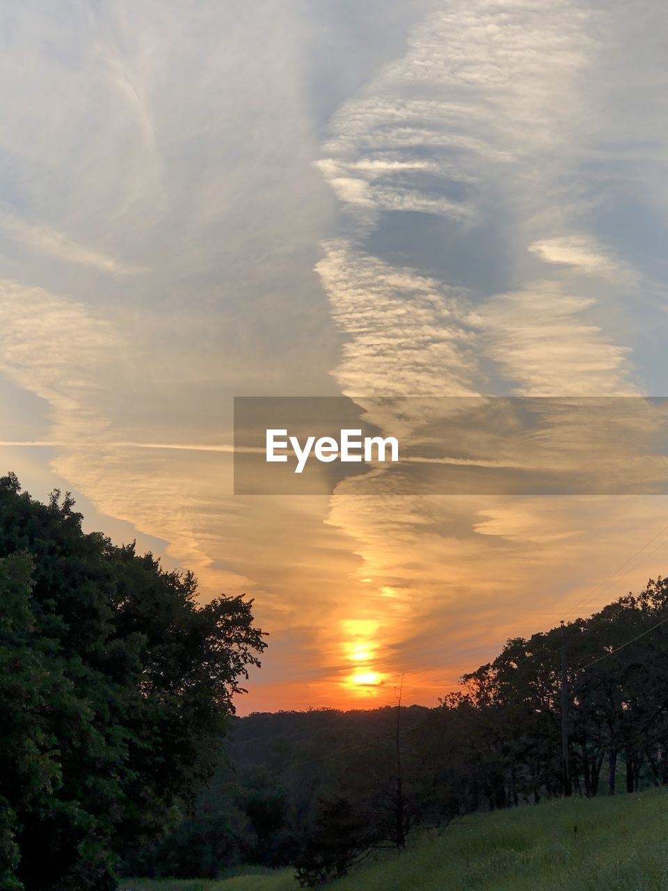 SCENIC VIEW OF LANDSCAPE AGAINST SKY AT SUNSET