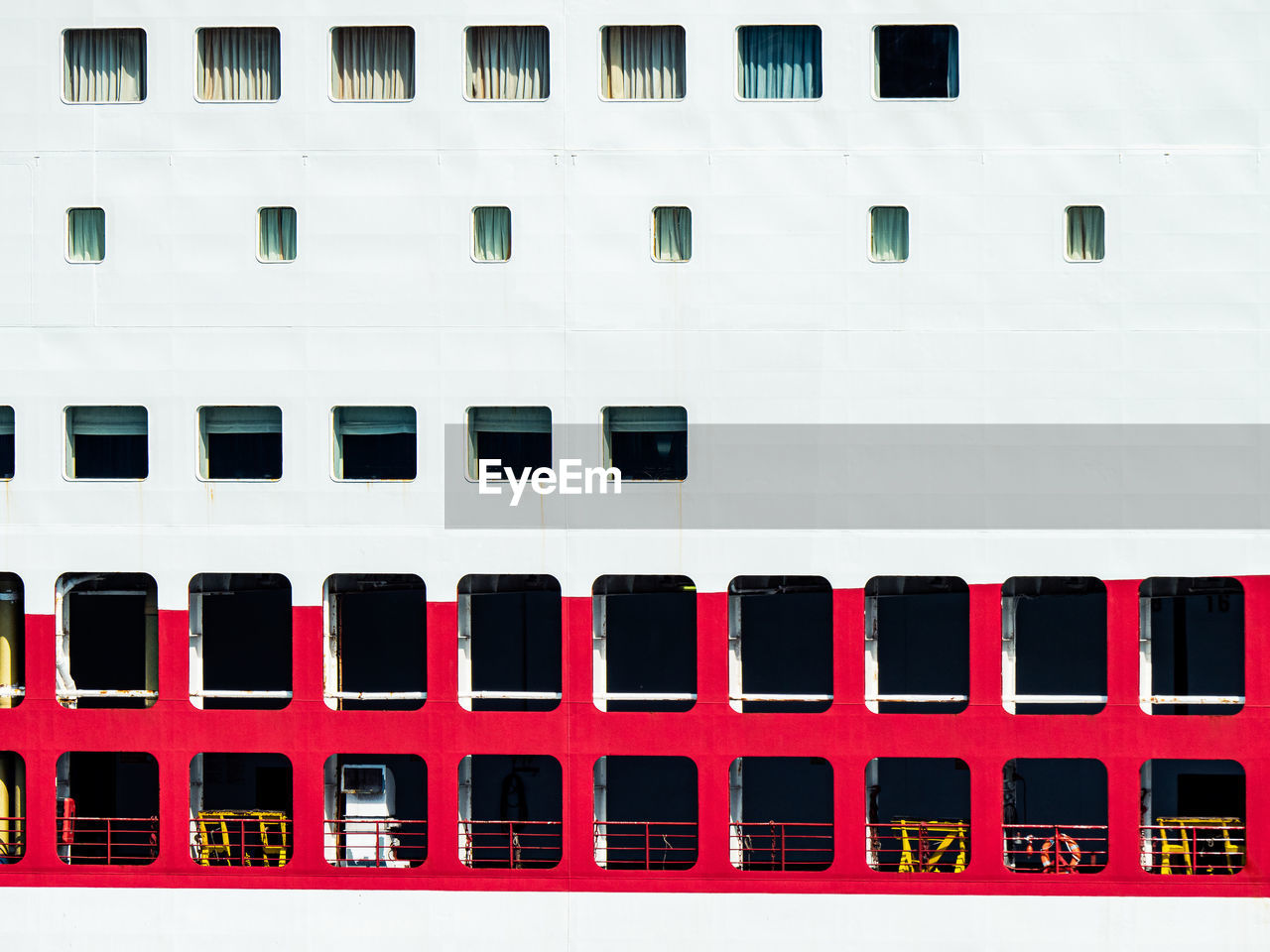 architecture, font, building exterior, window, built structure, no people, ship, building, red, side by side, in a row, white, day, outdoors