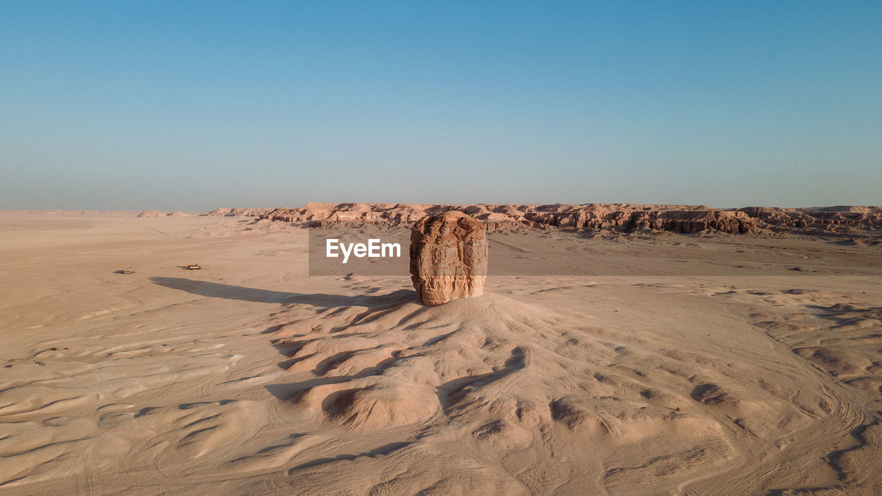 SAND DUNE IN DESERT AGAINST SKY