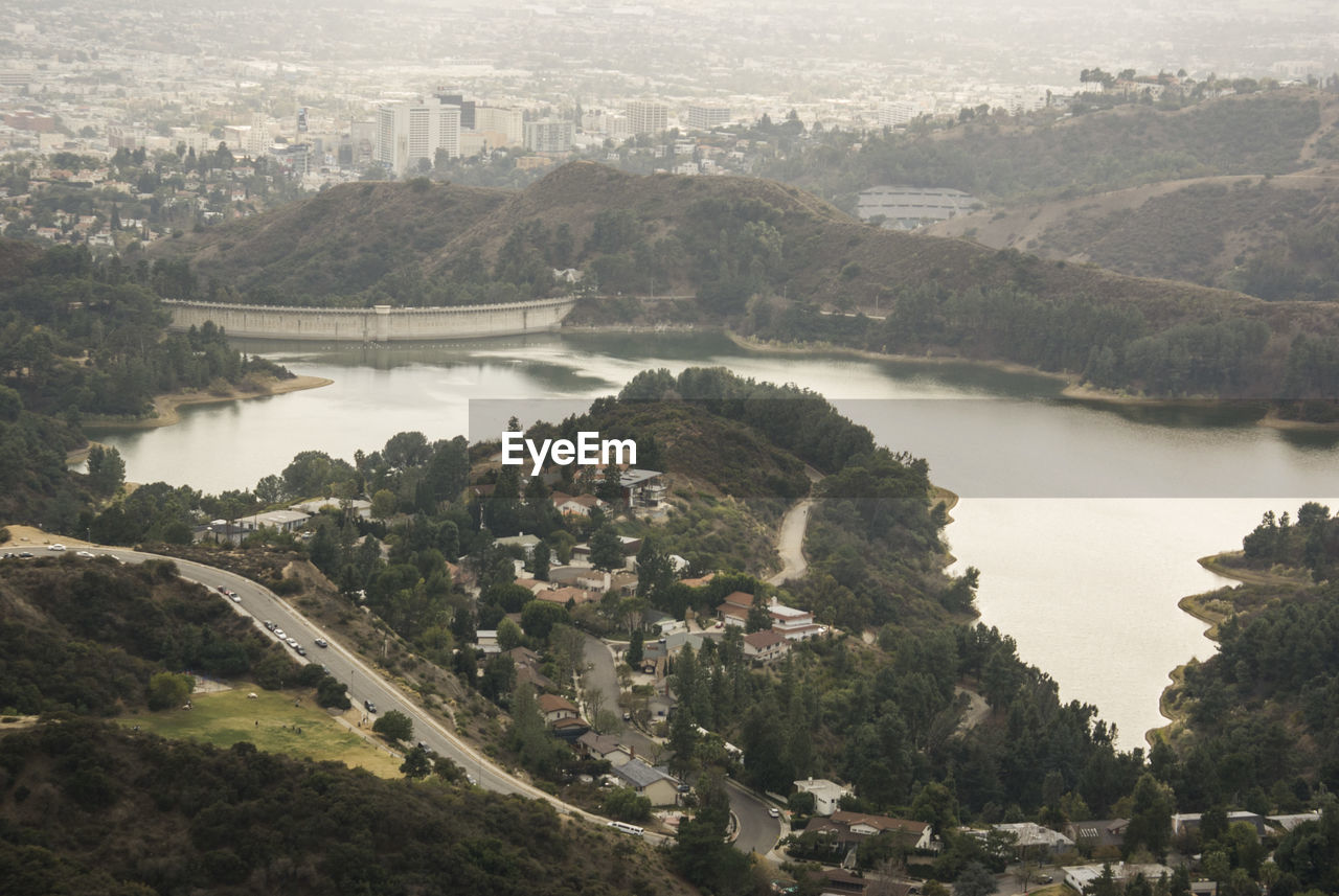 RIVER AMIDST CITYSCAPE