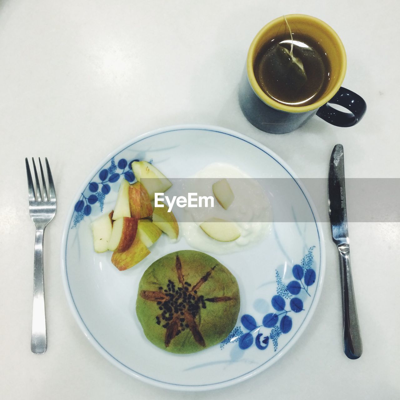 Fruits and green tea served on table