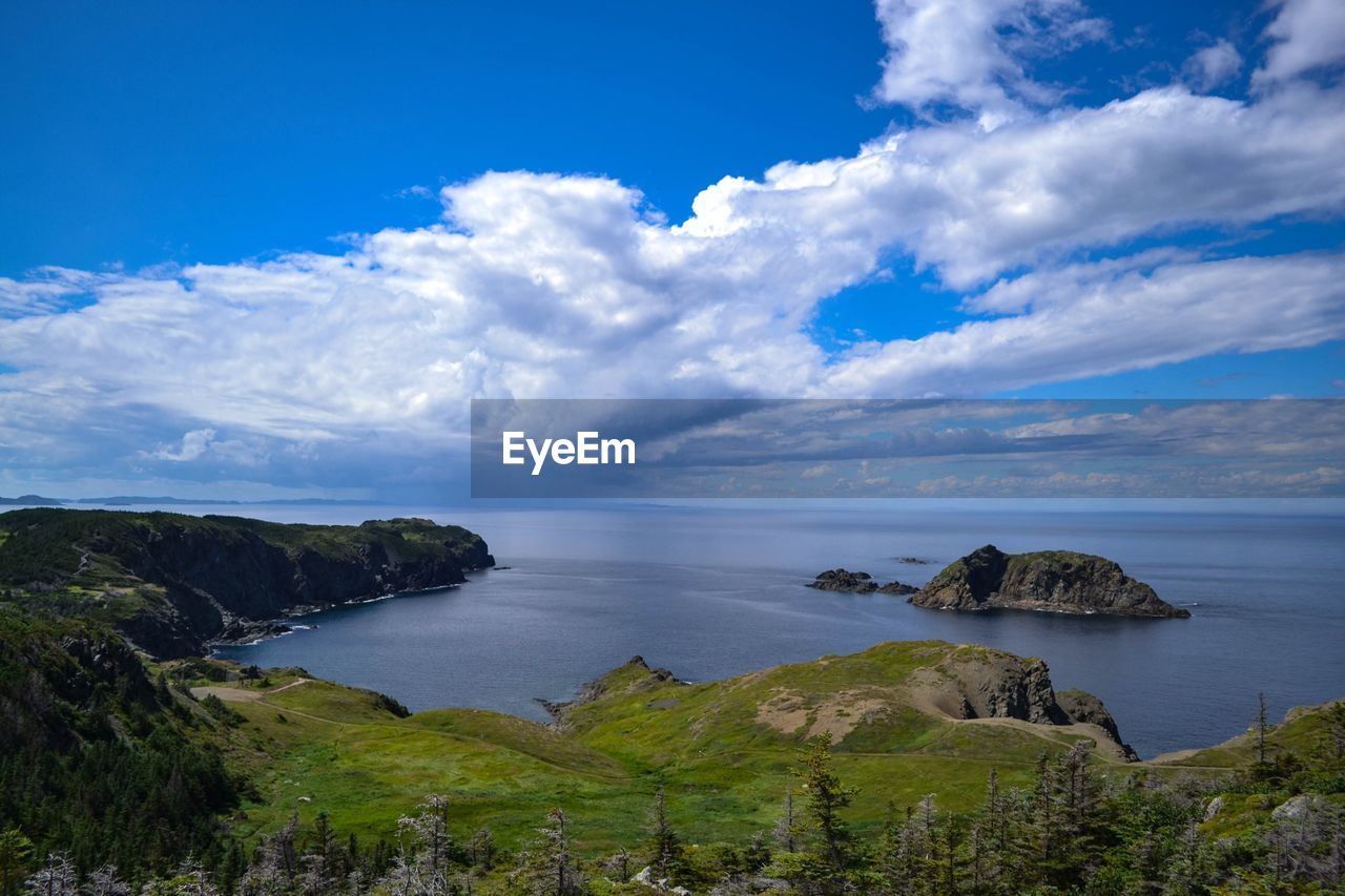 View of seascape against cloudy sky