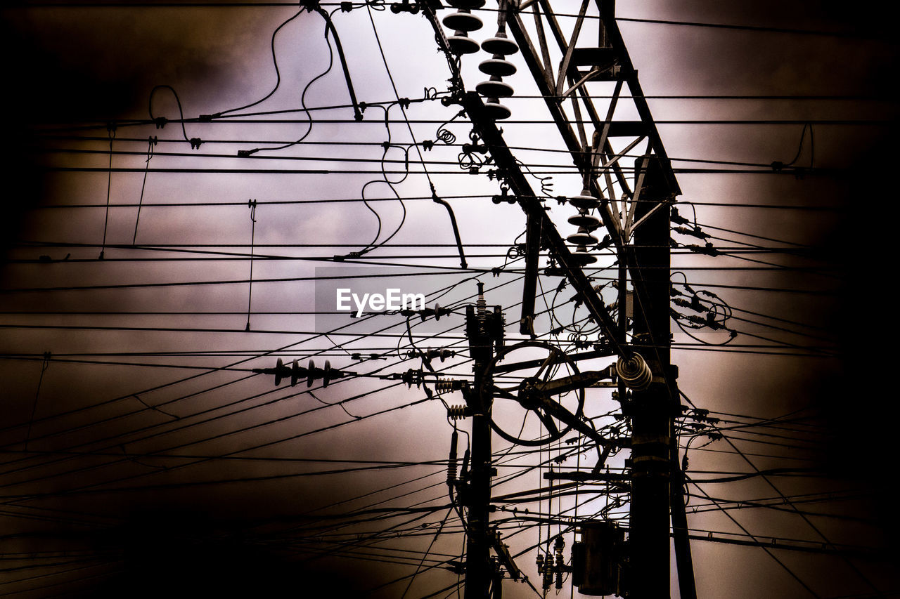 LOW ANGLE VIEW OF ELECTRICITY PYLONS AGAINST SKY