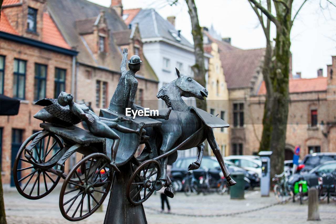 Statue zeus, leda, prometheus and pegasus visit bruges by jef claerhout in honor to city coachmen