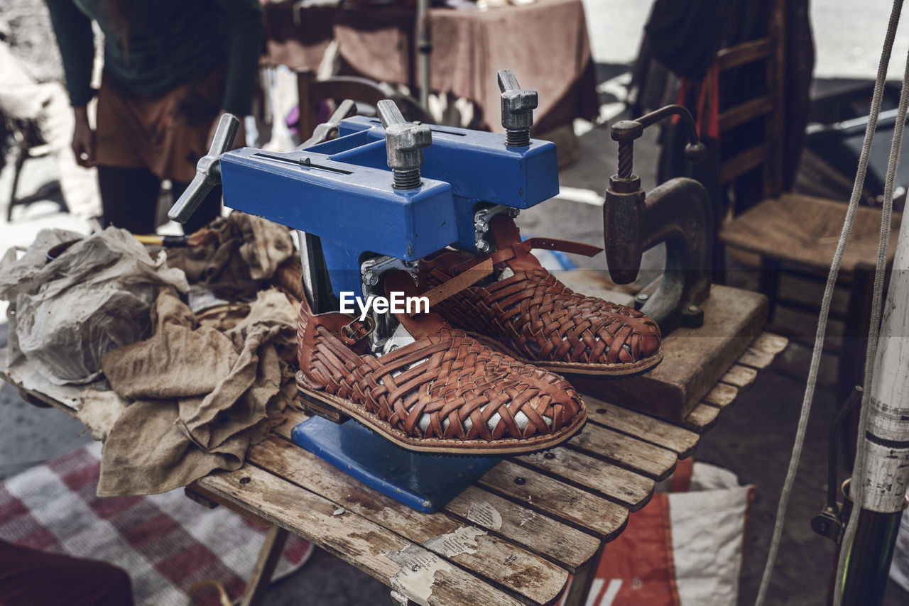 High angle view of old shoes at workshop