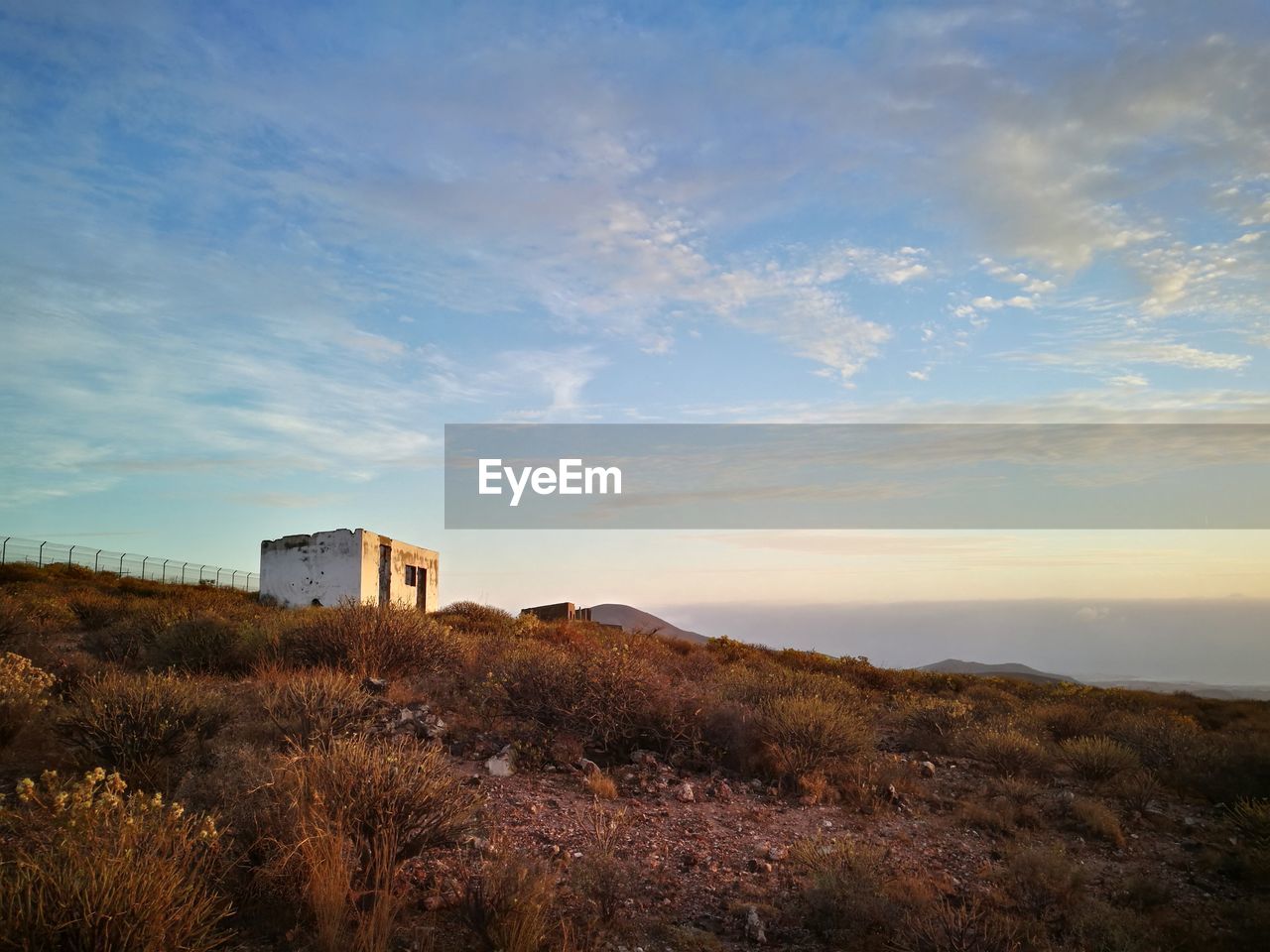 Scenic view of field against sky during sunset