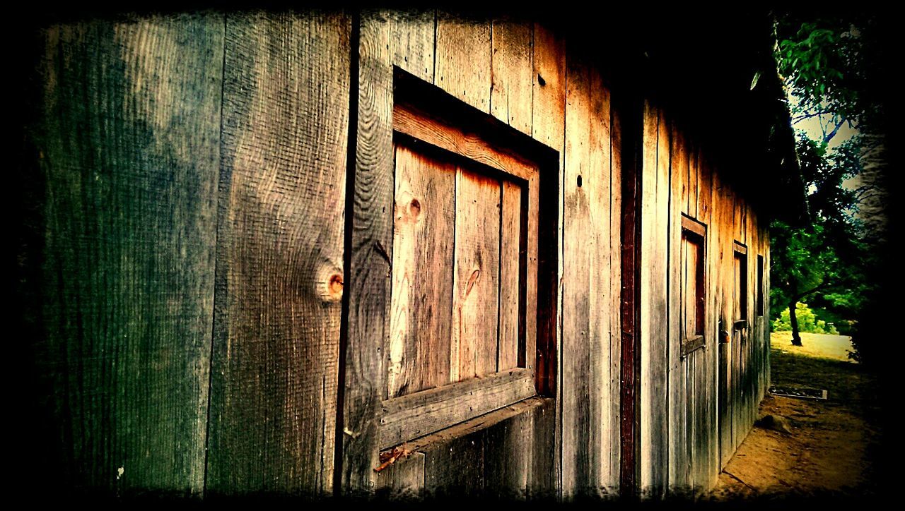 CLOSED WOODEN DOOR OF OLD BUILDING