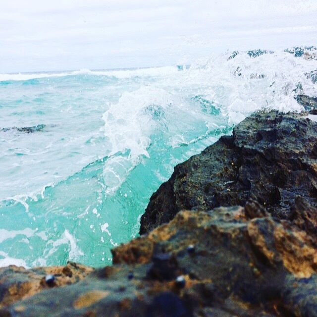 WAVES SPLASHING ON SHORE