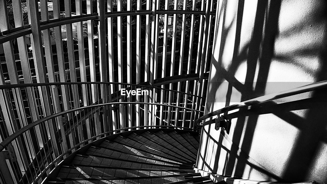 High angle view of spiral staircase by railing