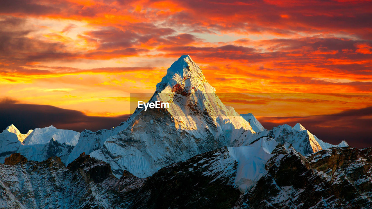 scenic view of snowcapped mountain against sky during sunset