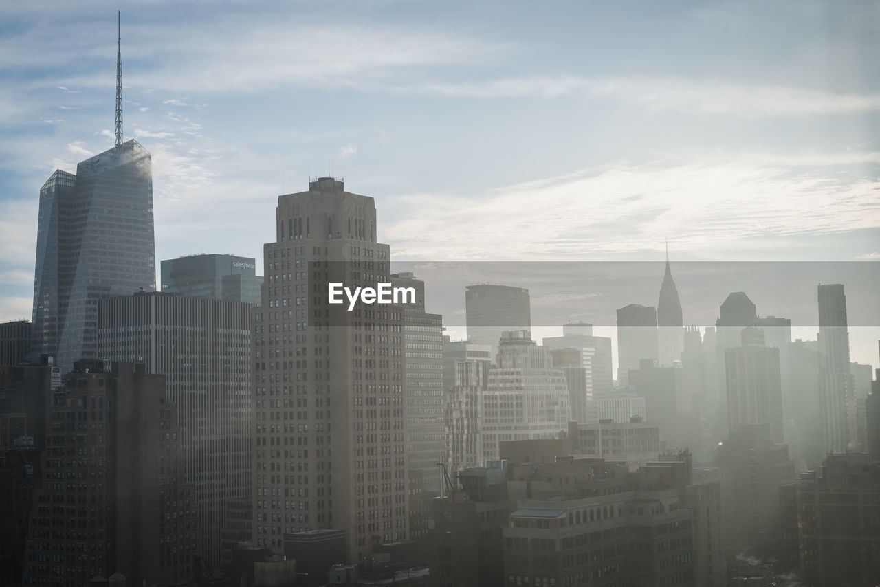 Modern buildings in city against sky