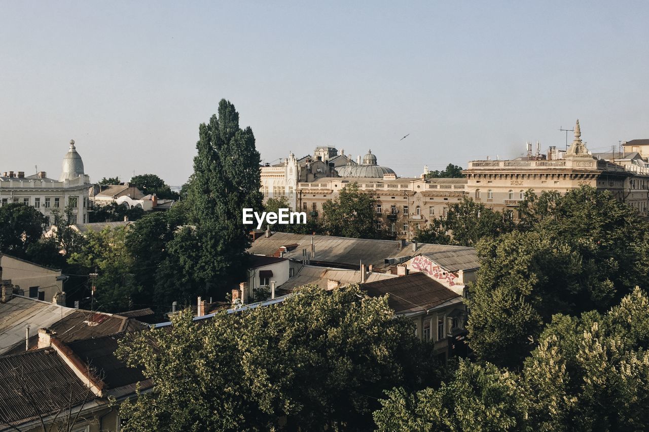 Buildings in city against sky