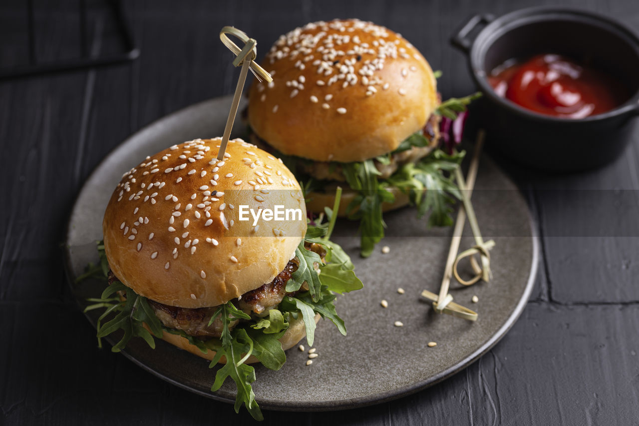 Burgers with chicken cutlet and greens