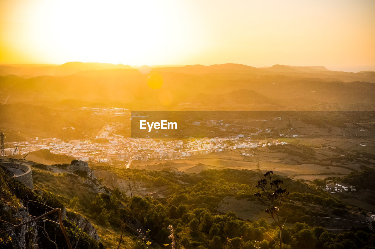 Scenic view of landscape against sky during sunset