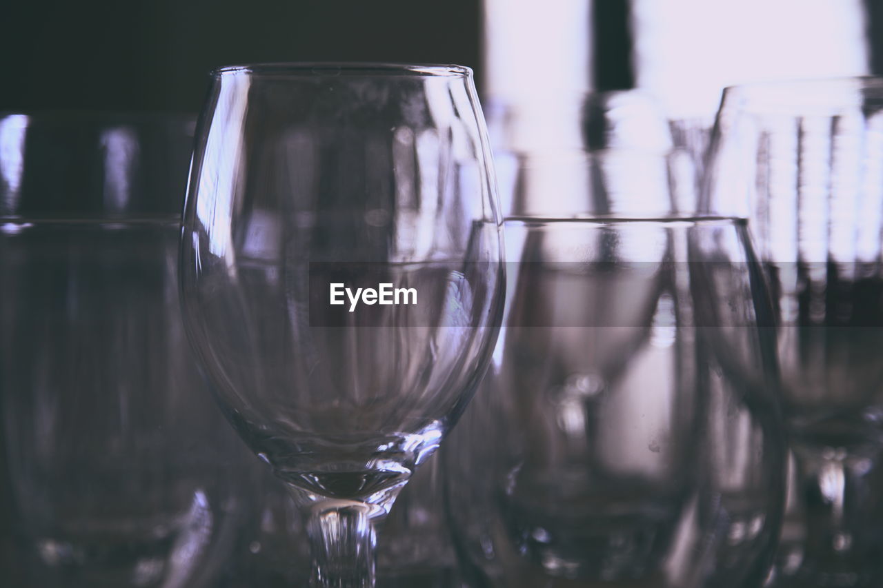 Close-up of wineglasses on table