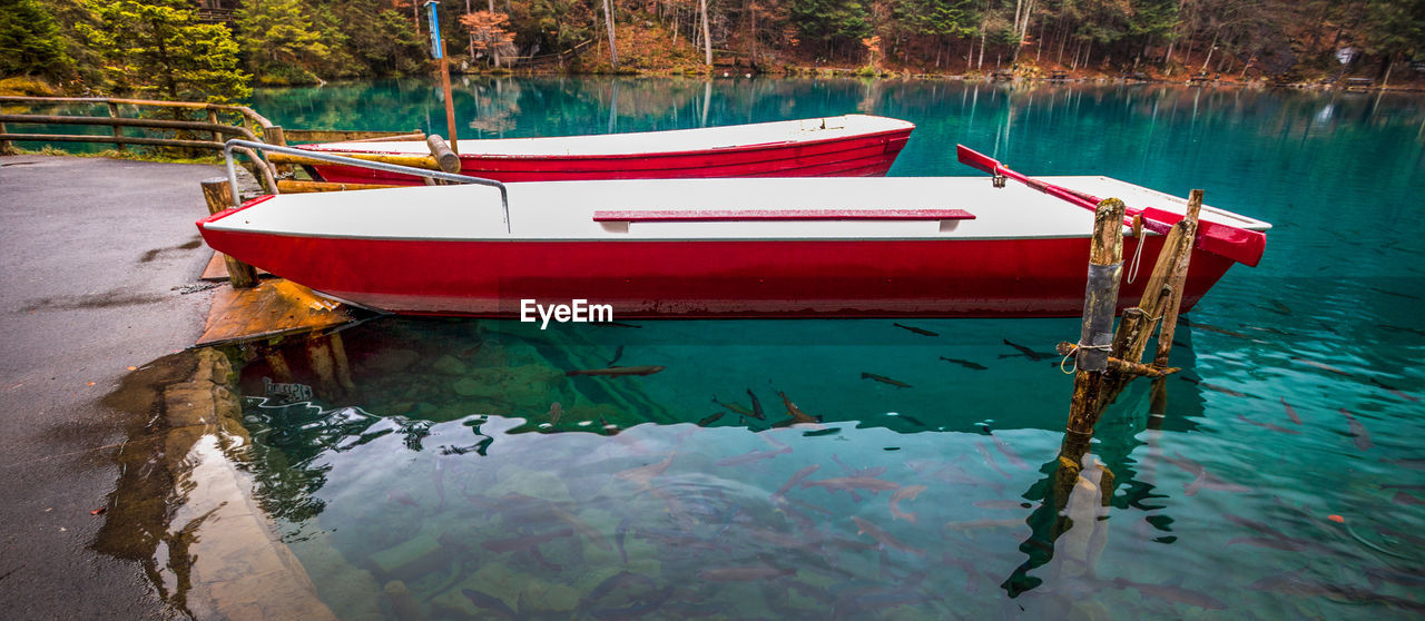 Boats moored on lake