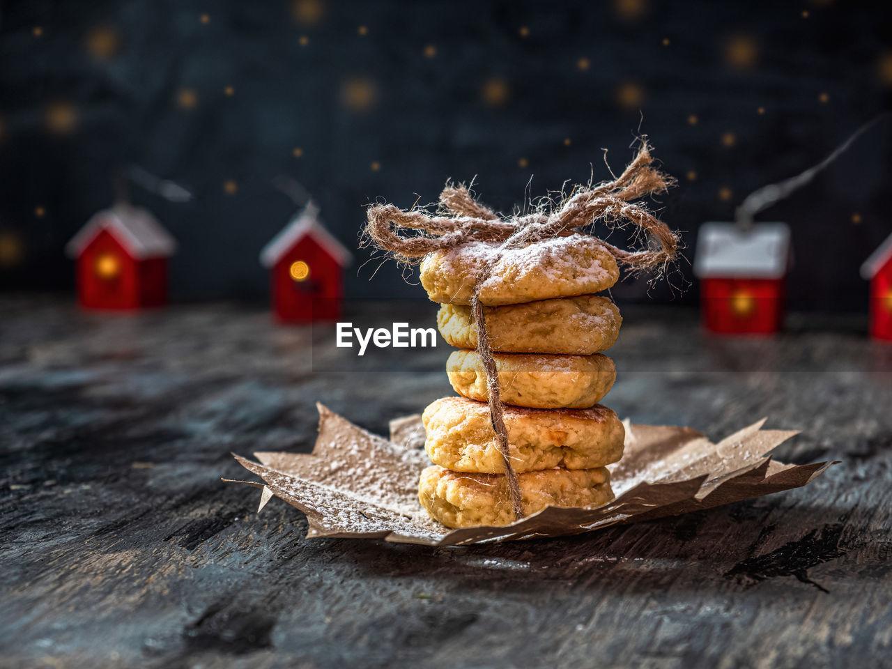 Christmas card with cookies and red lamps in the shape of houses,