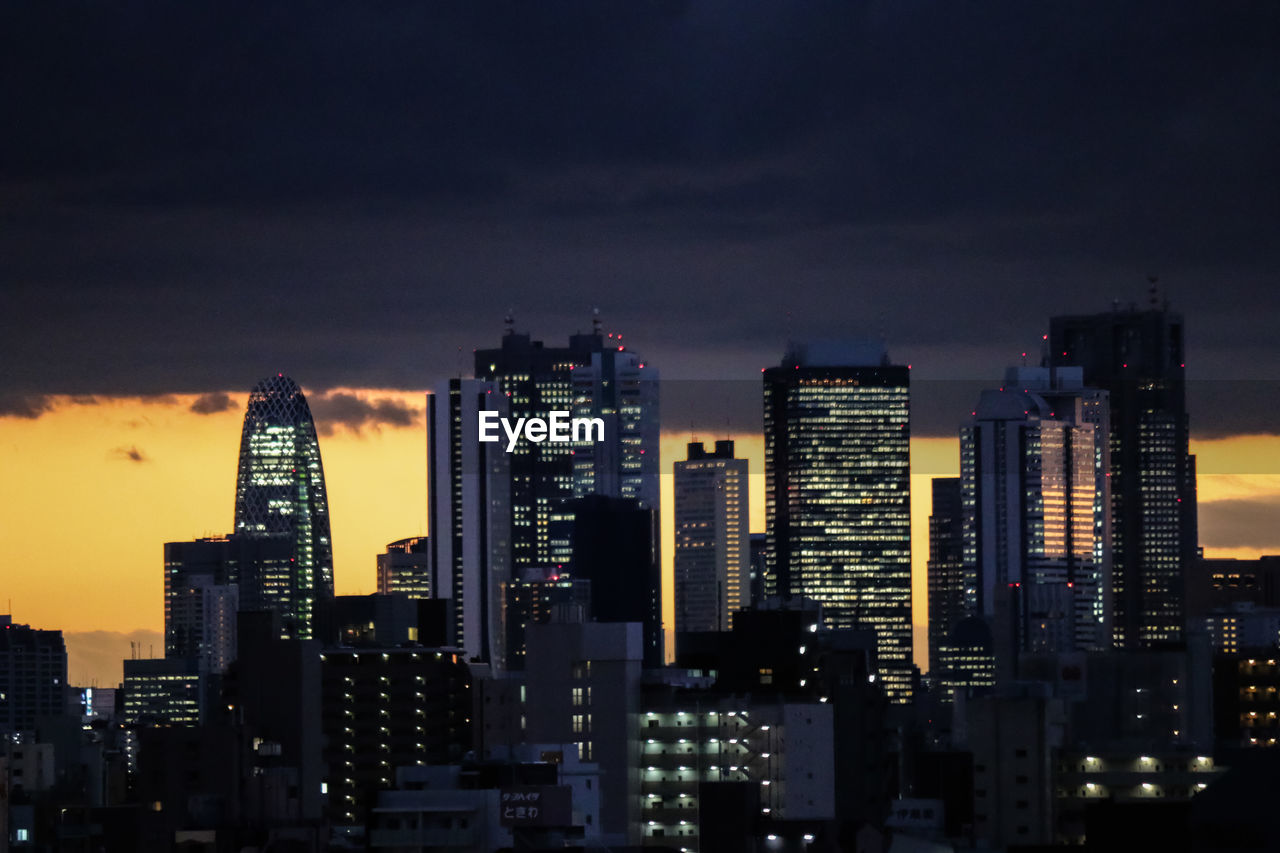 View of skyscrapers lit up at night