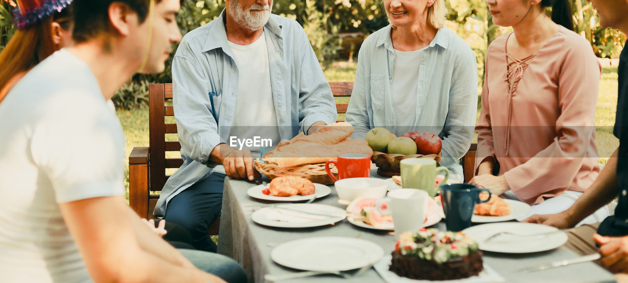 GROUP OF PEOPLE ON TABLE