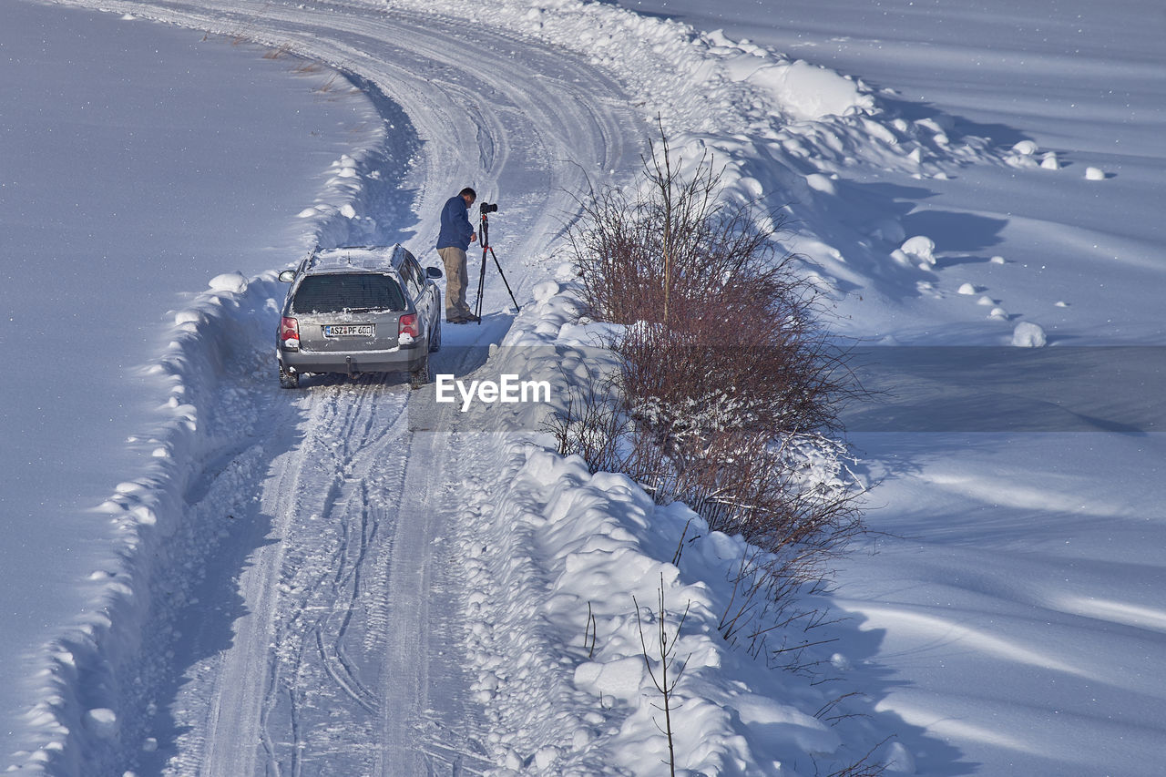 CARS ON SNOW COVERED MOUNTAINS