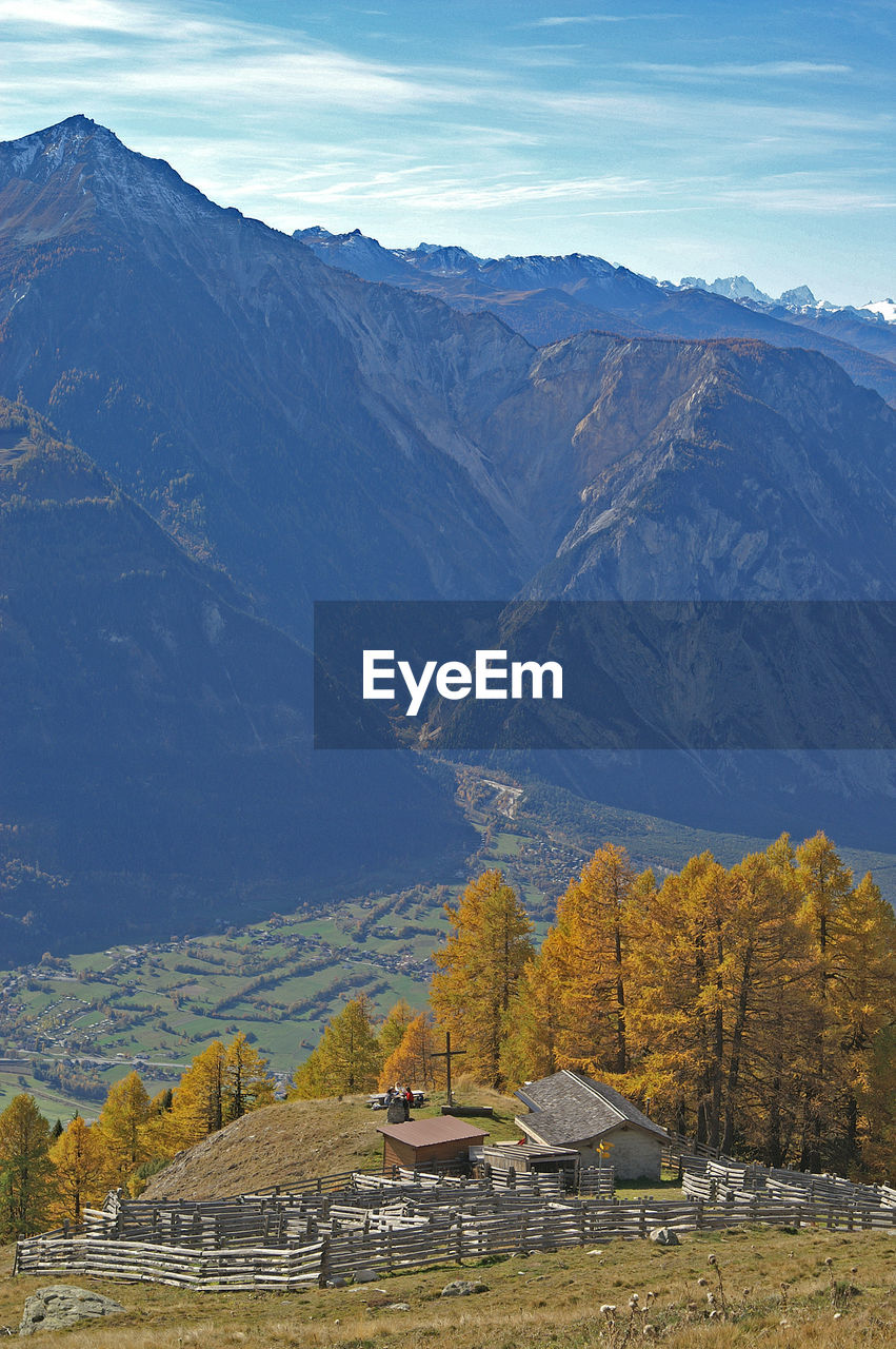 Scenic view of mountains against cloudy sky