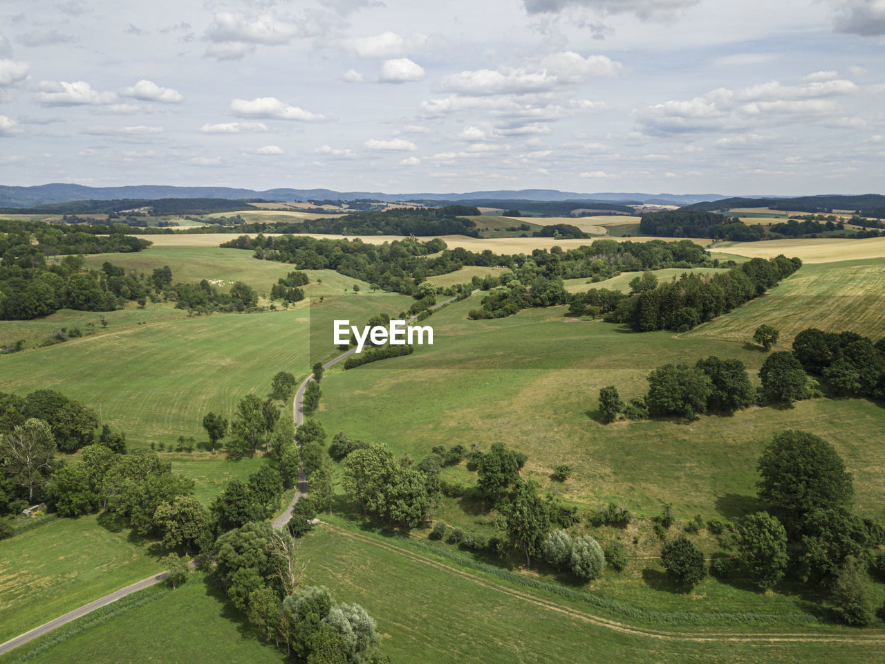 SCENIC VIEW OF FARM AGAINST SKY