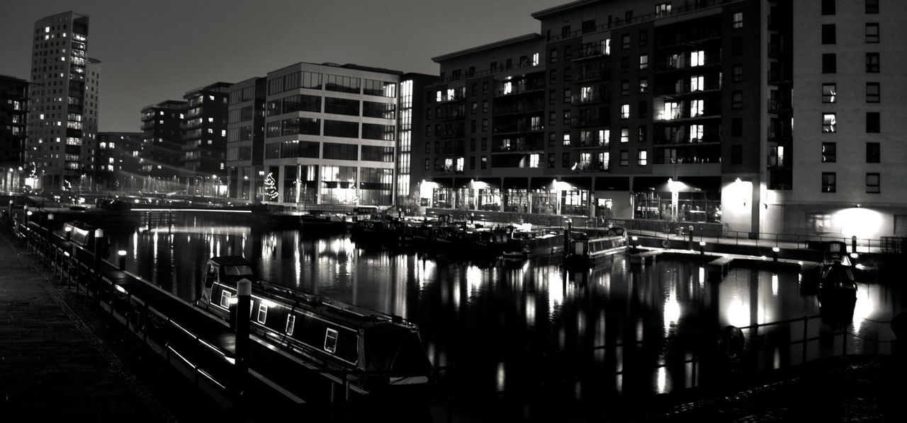 REFLECTION OF ILLUMINATED BUILDINGS IN WATER