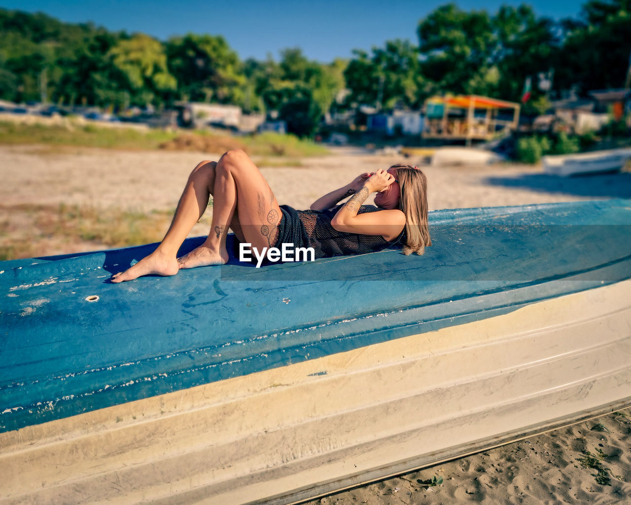 Woman lying down on boat