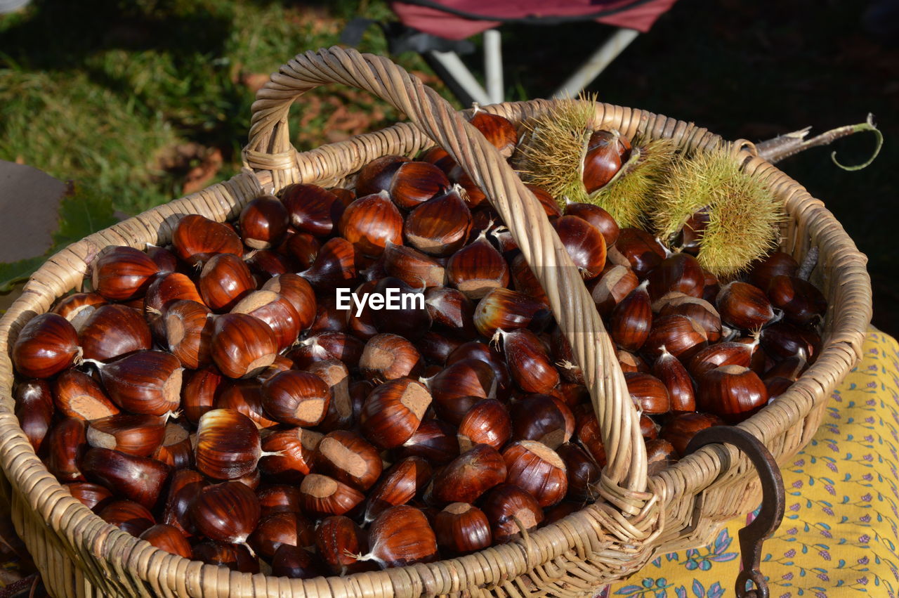 Chestnuts in a braided basket on a table