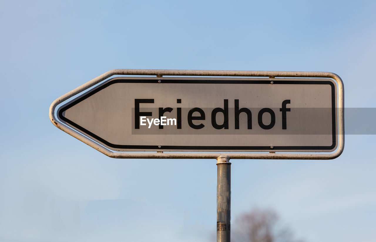 LOW ANGLE VIEW OF ROAD SIGN AGAINST SKY