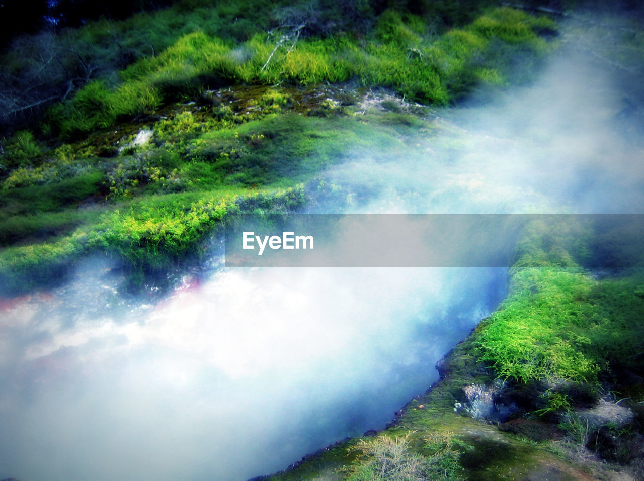 SCENIC VIEW OF WATER FLOWING THROUGH LAND