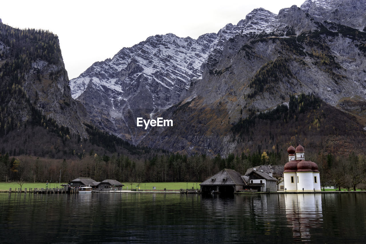 Scenic view of lake and mountains against sky