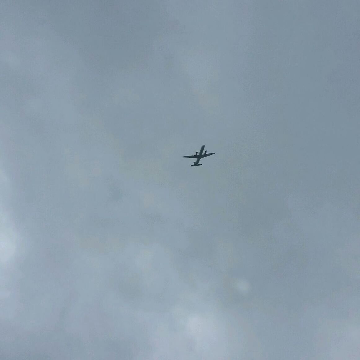 LOW ANGLE VIEW OF AIRPLANE FLYING OVER SKY