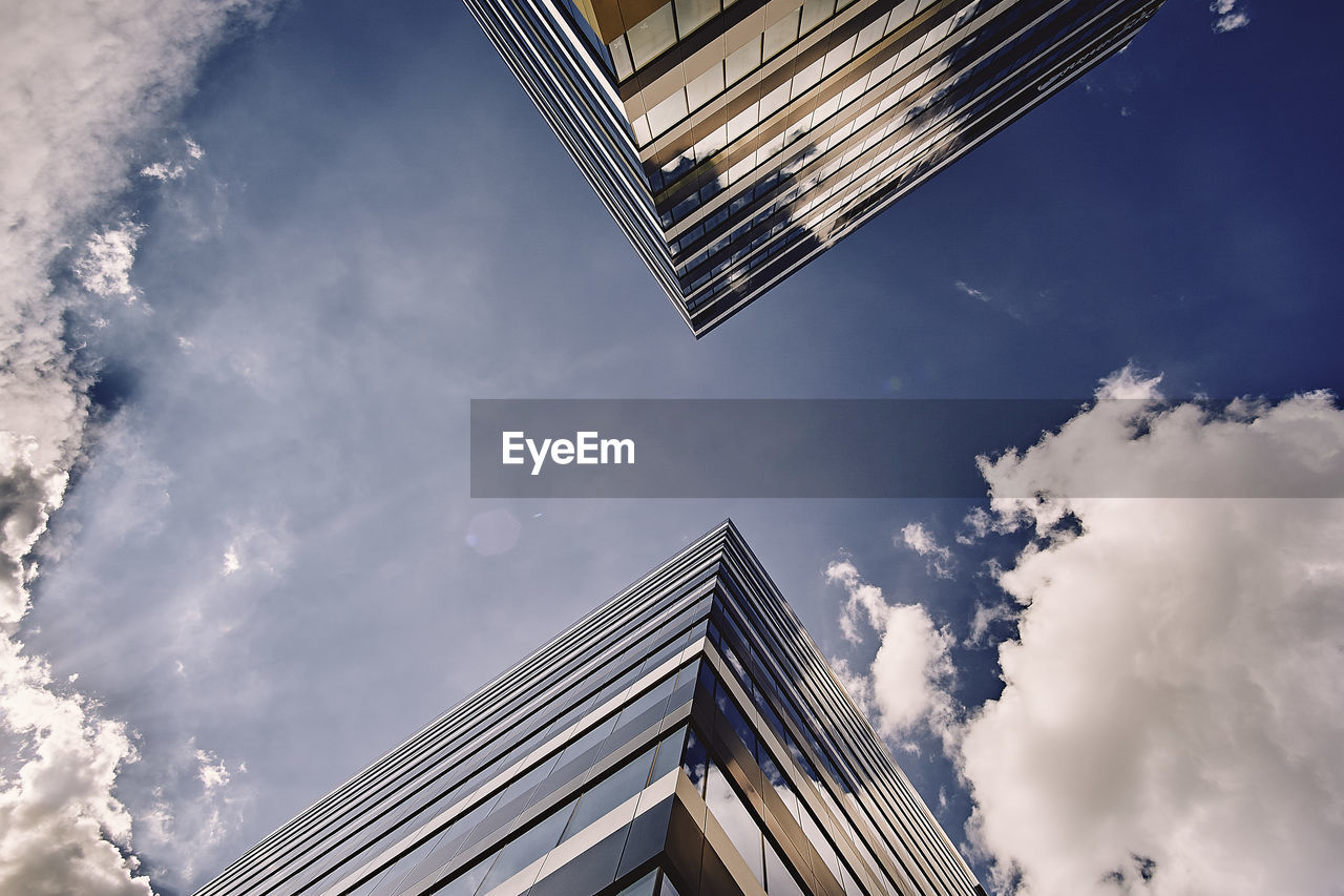 Low angle view of modern buildings against sky