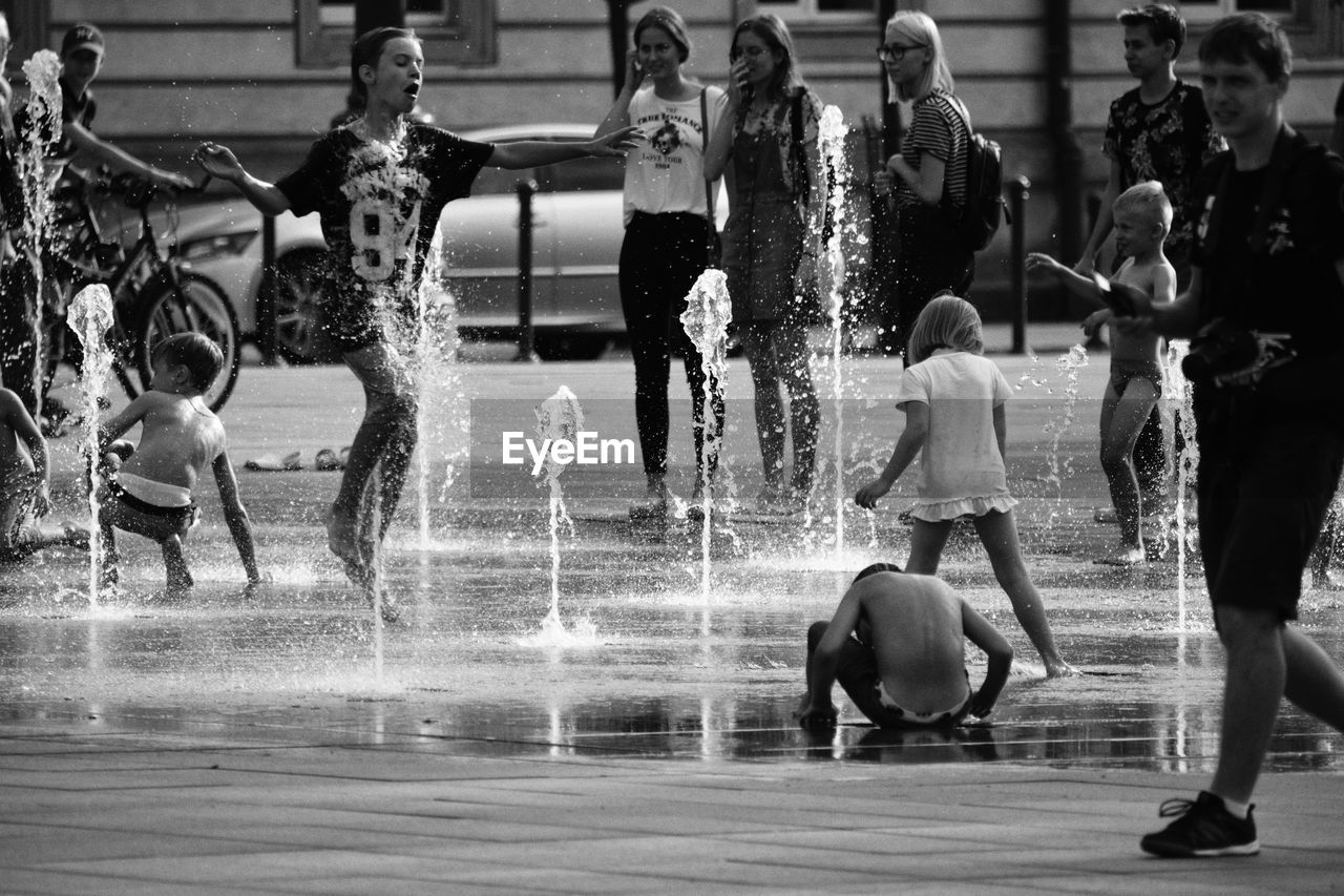 PEOPLE IN SWIMMING POOL