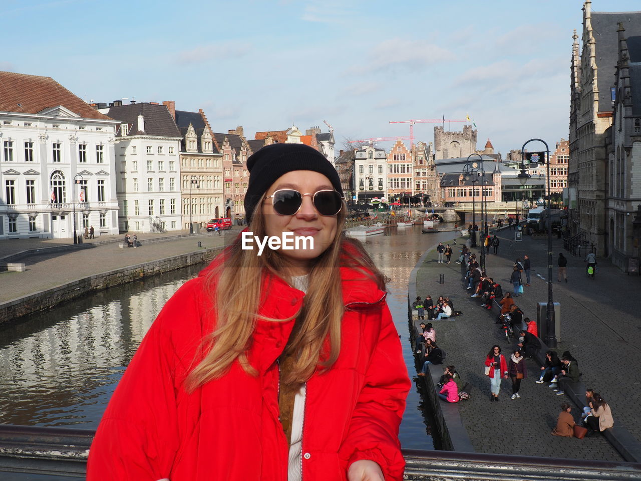 Portrait of woman standing in city