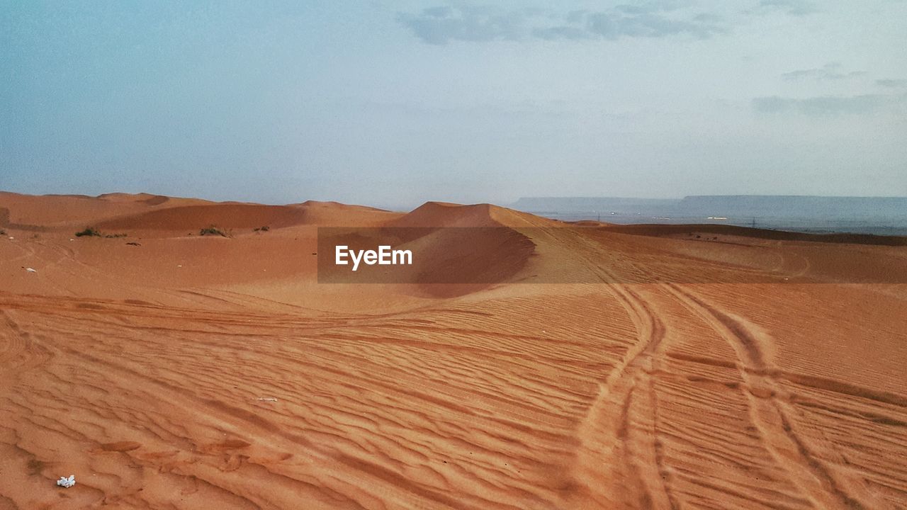 Scenic view of desert against sky