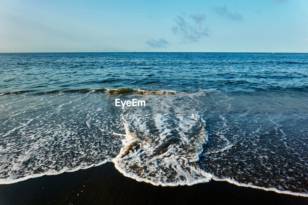 Scenic view of sea shore against sky