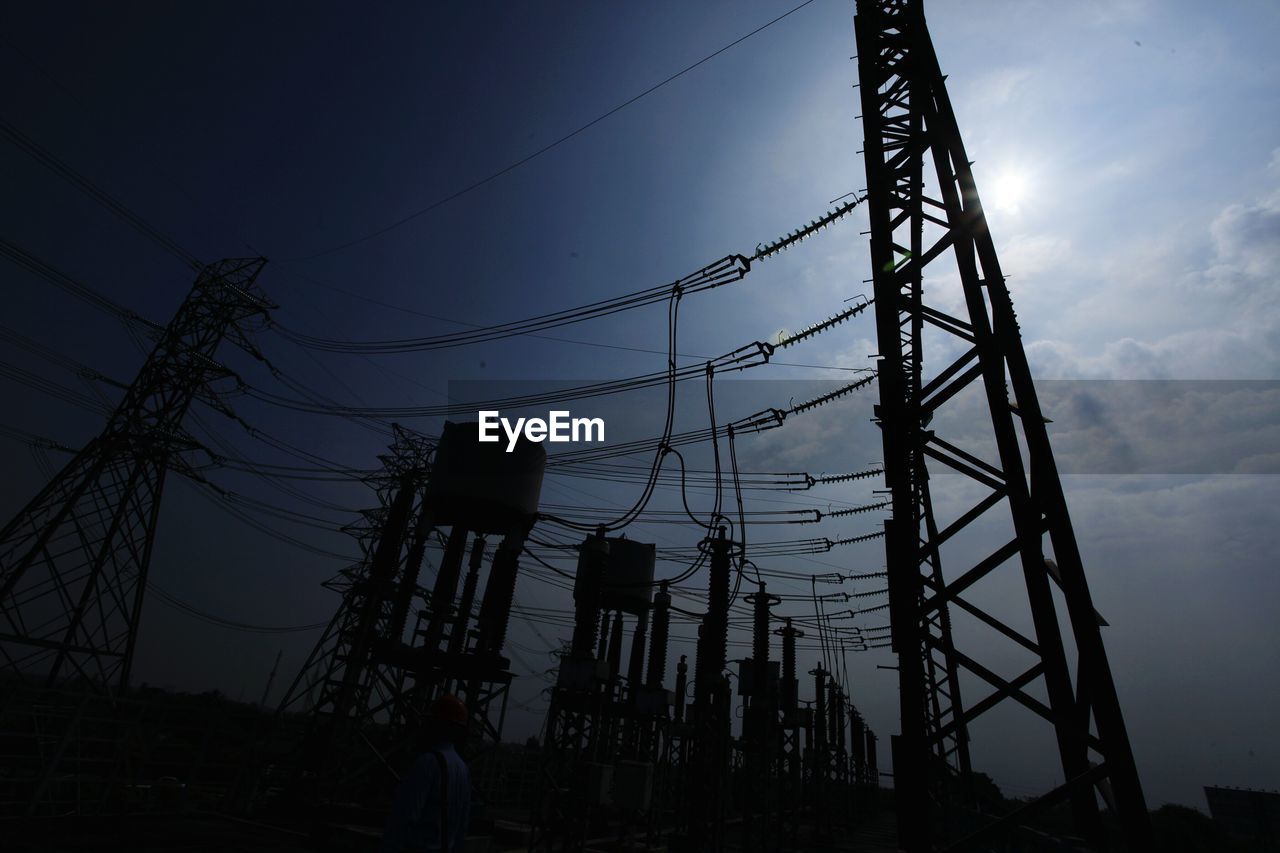 LOW ANGLE VIEW OF SILHOUETTE ELECTRICITY PYLON