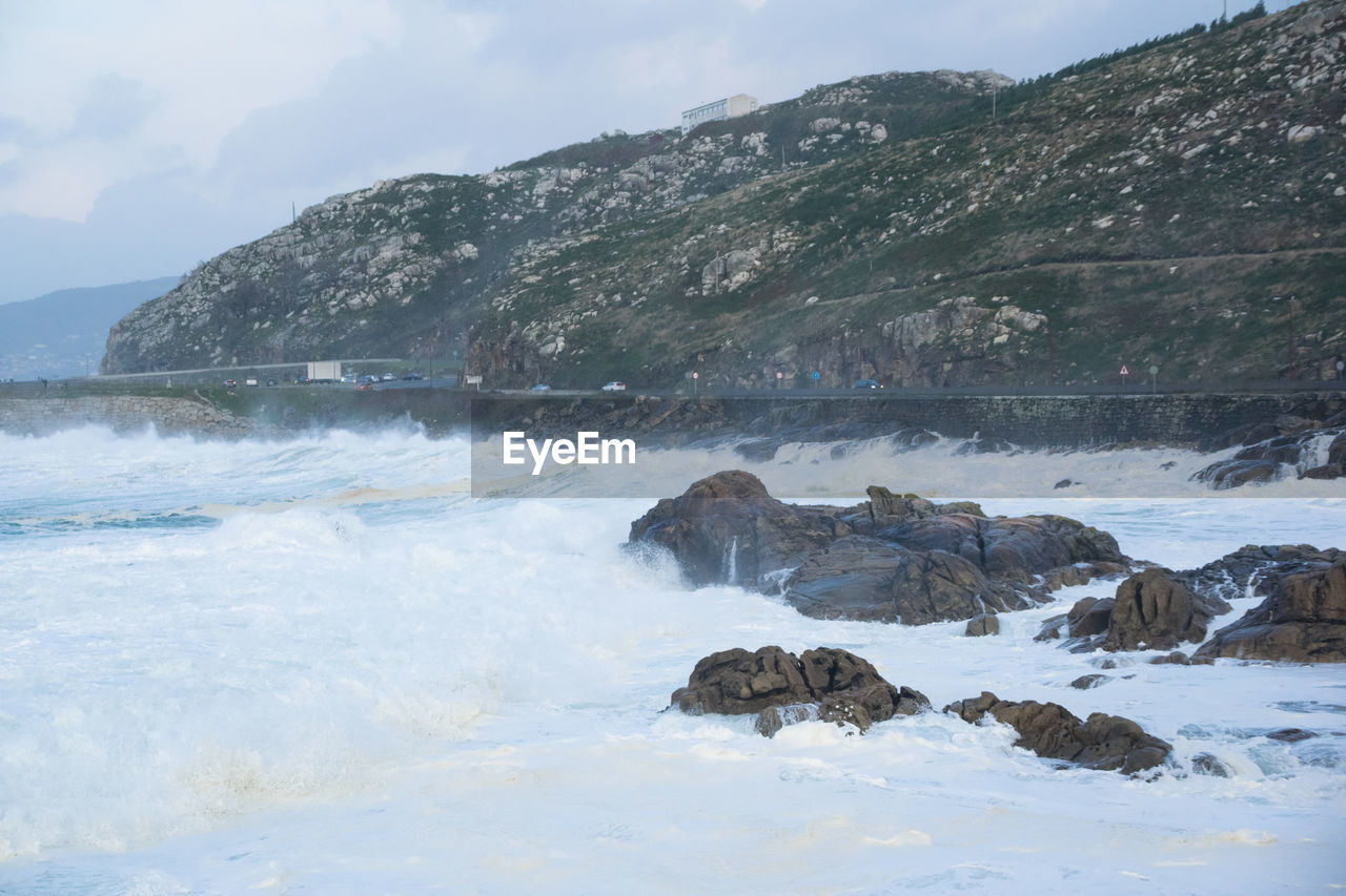 Waves crashing into the coast of galicia after a stormy day