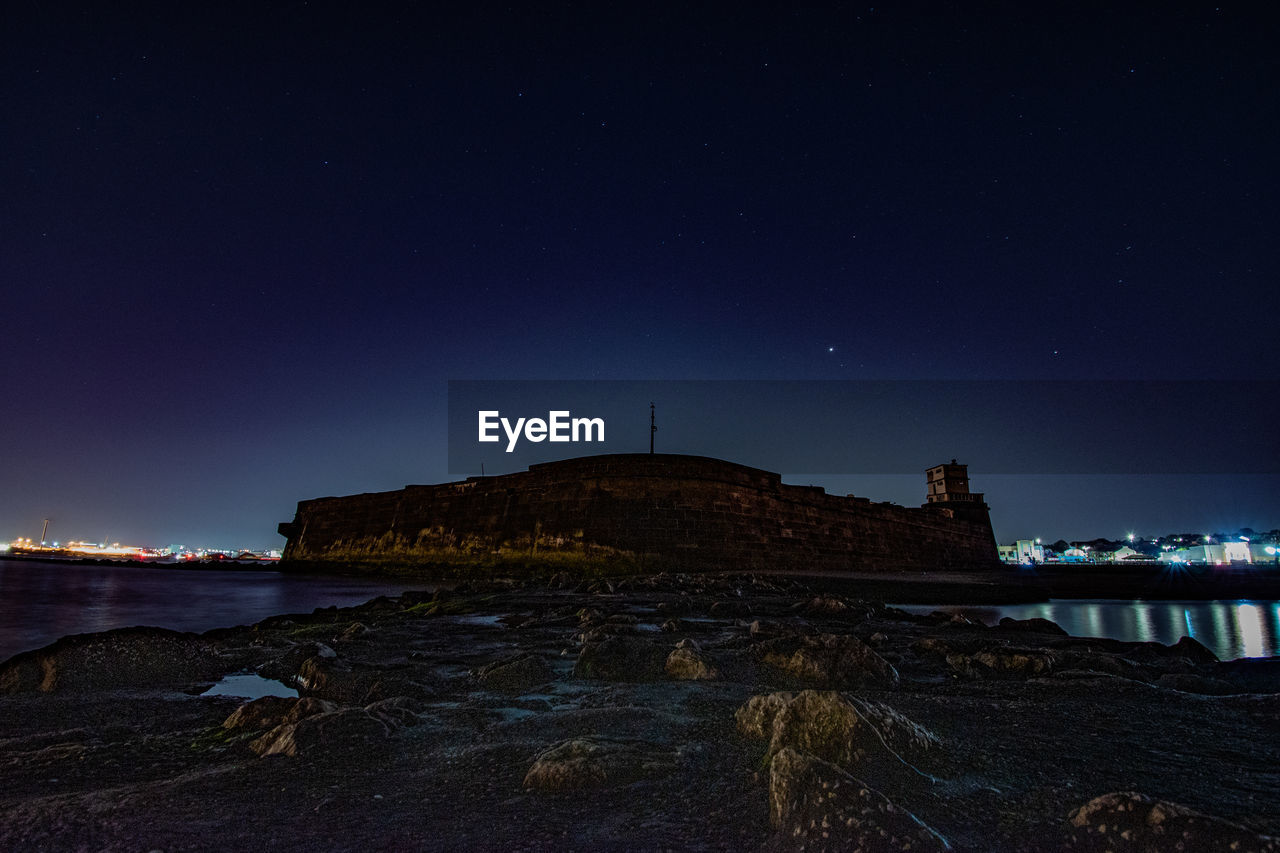 Scenic view of sea against sky at night