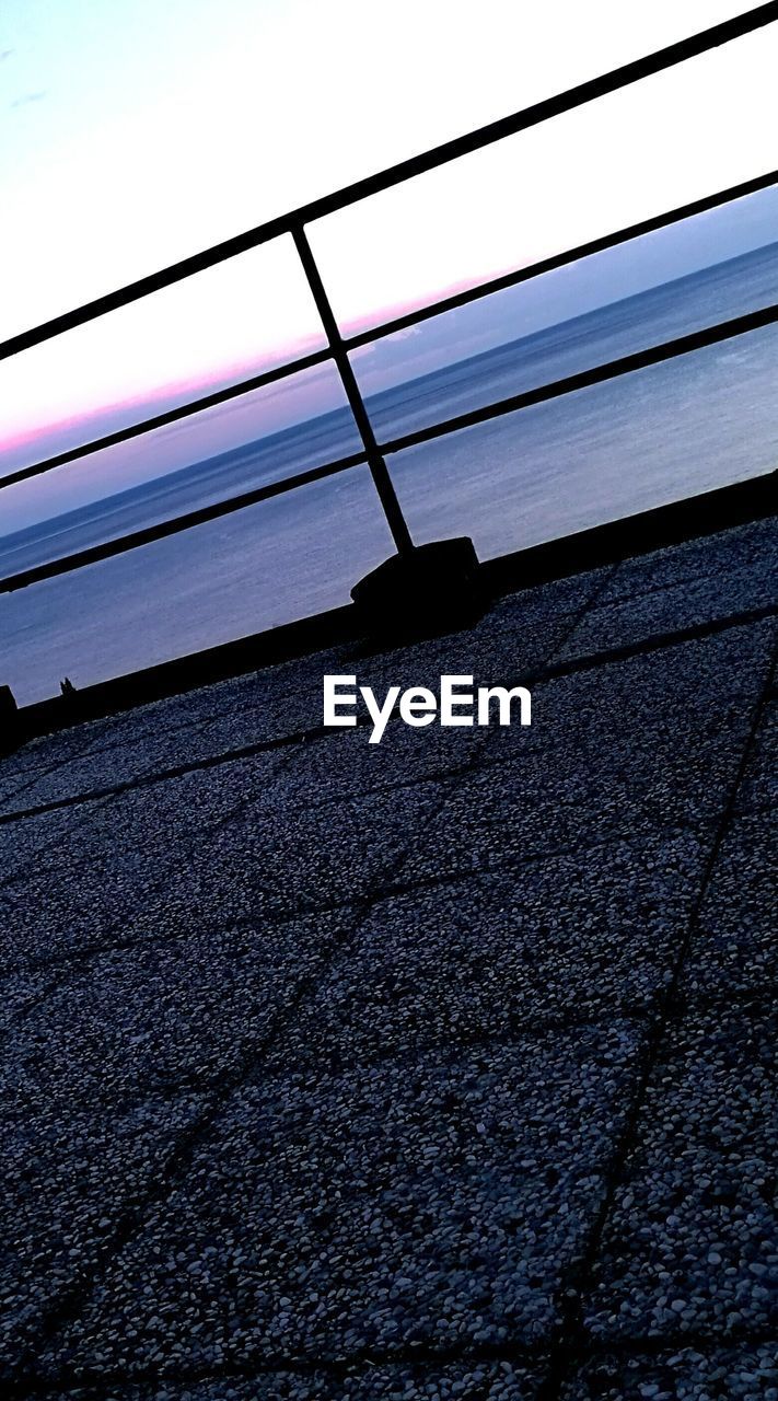 CLOSE-UP OF METAL AGAINST SKY